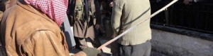 صور.. داعش يجلد سورياً بتهمة عزف الموسيقى